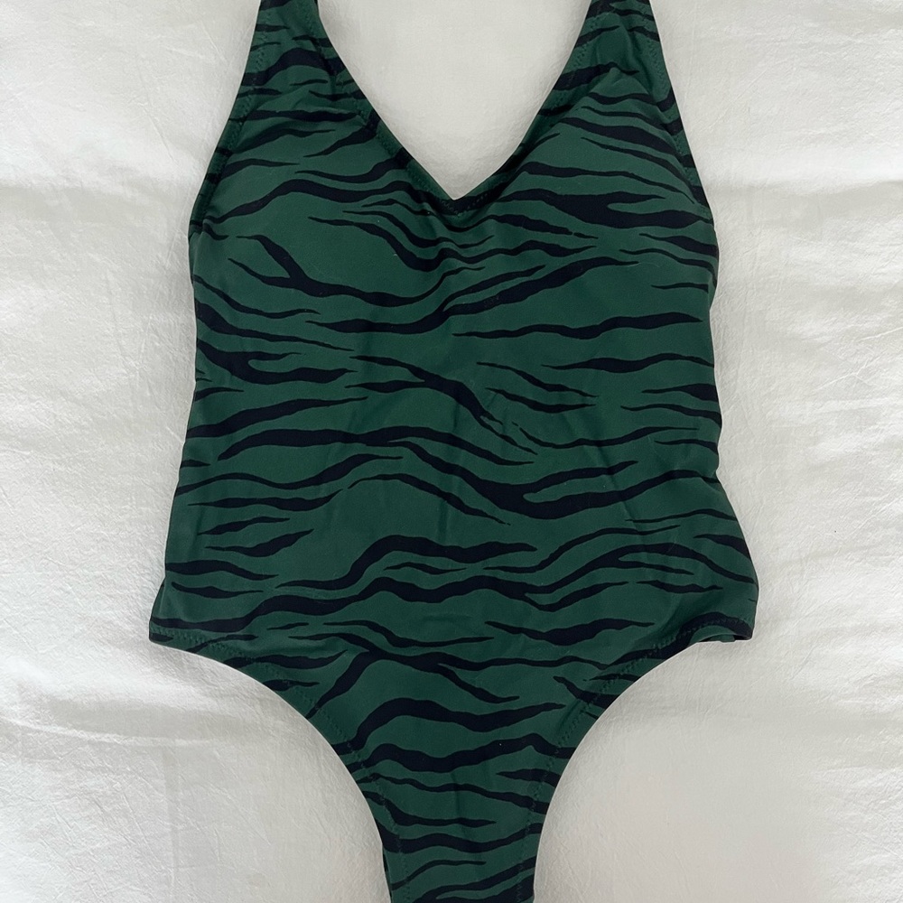 Navy green and black zebra patterned one piece. Size XS